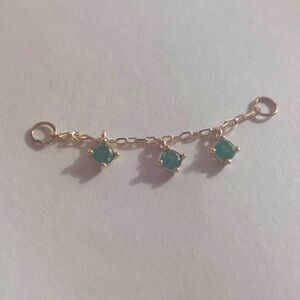 Custom made 14k gold peircing chain with 3 emeralds